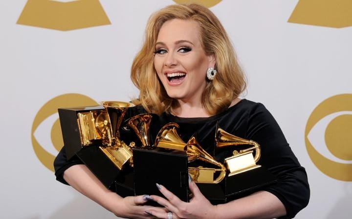 Adele sweeps Grammy awards in shock victory over Beyonce