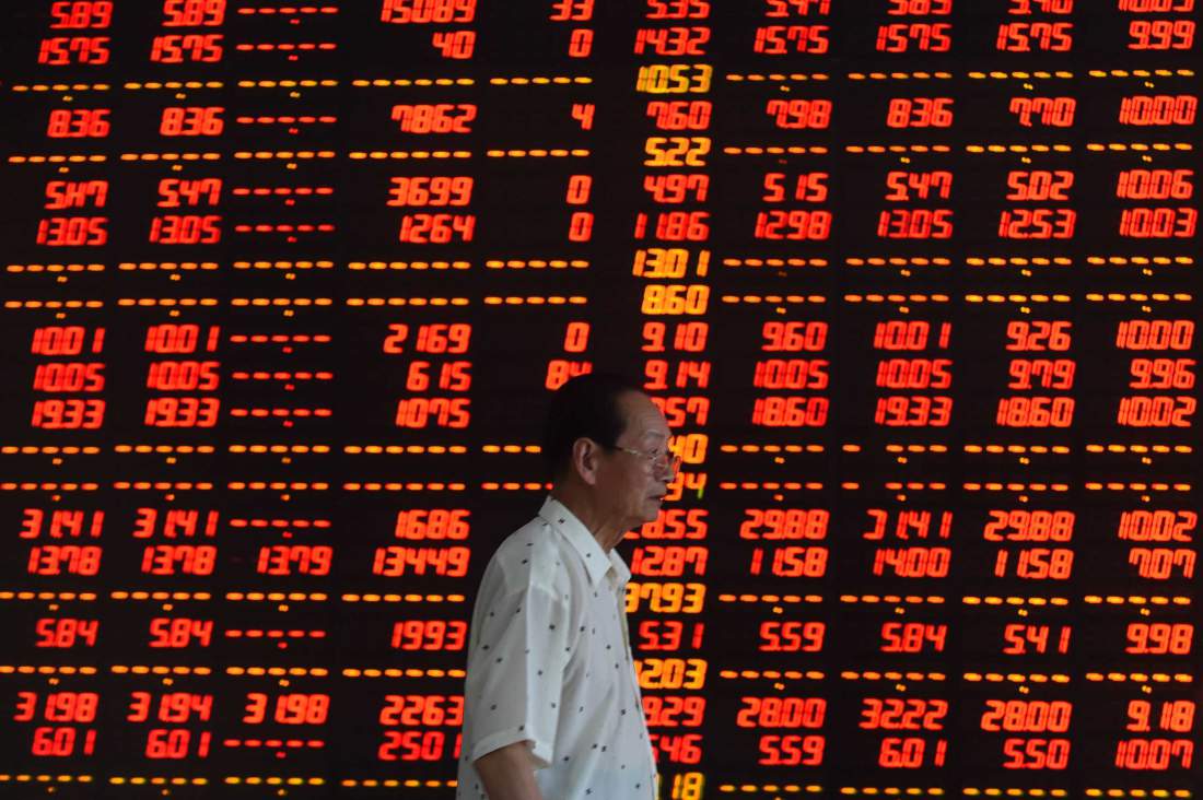 China Shares Gain on Spending Program; Crude Jumps