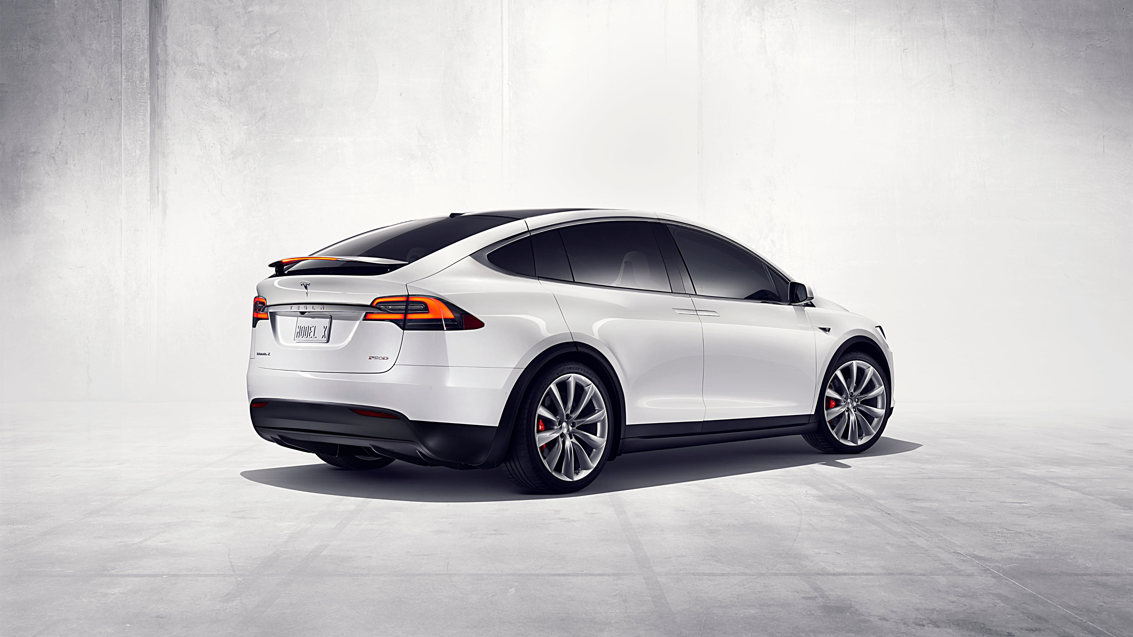 Tesla lowers price of Model X, saying margins improved