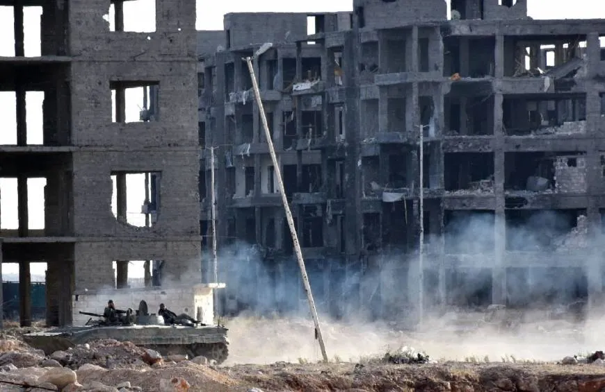 Syrian state TV says army takes key Aleppo district