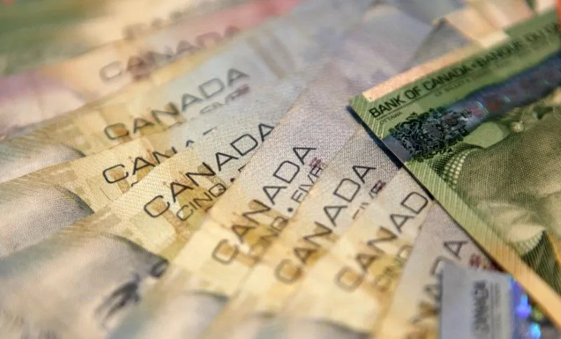 U.S. Stocks Near Records, Canadian Dollar Weakens