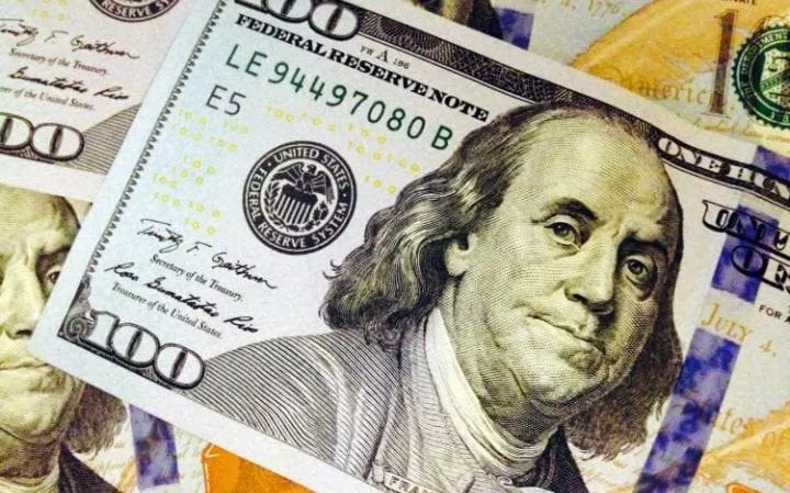 Dollar wavers near highs as investors await Fed this week
