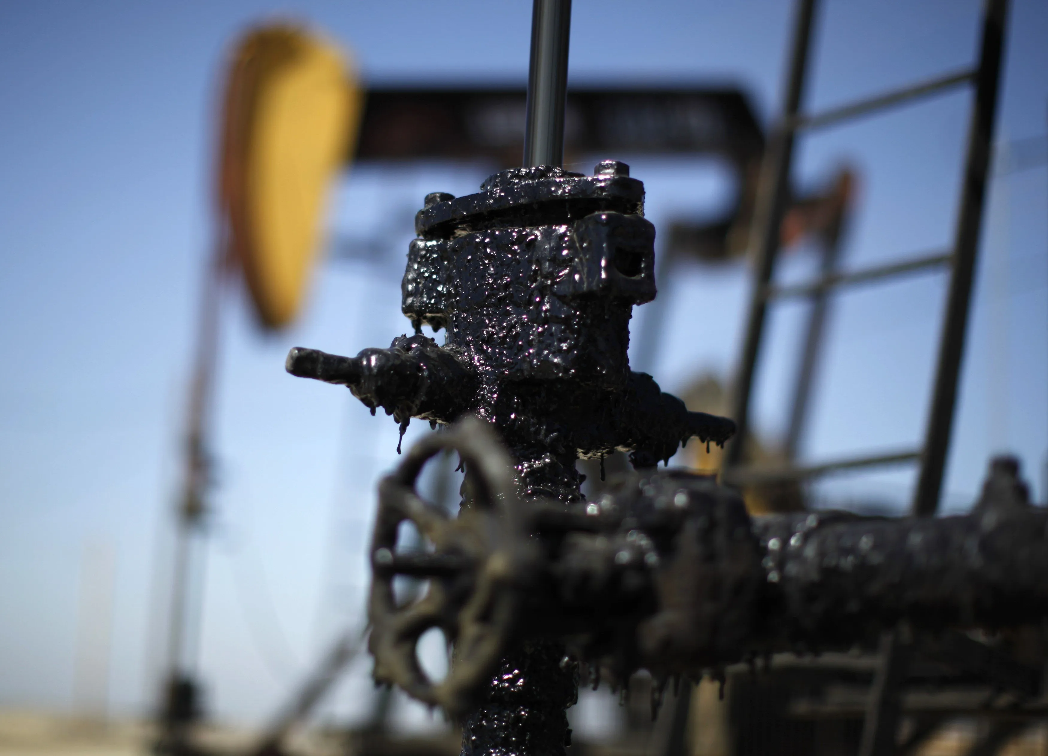 Oil dips on stronger dollar; rise in U.S. crude stocks data