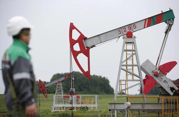 Oil surges after output cuts, strong dollar weighs